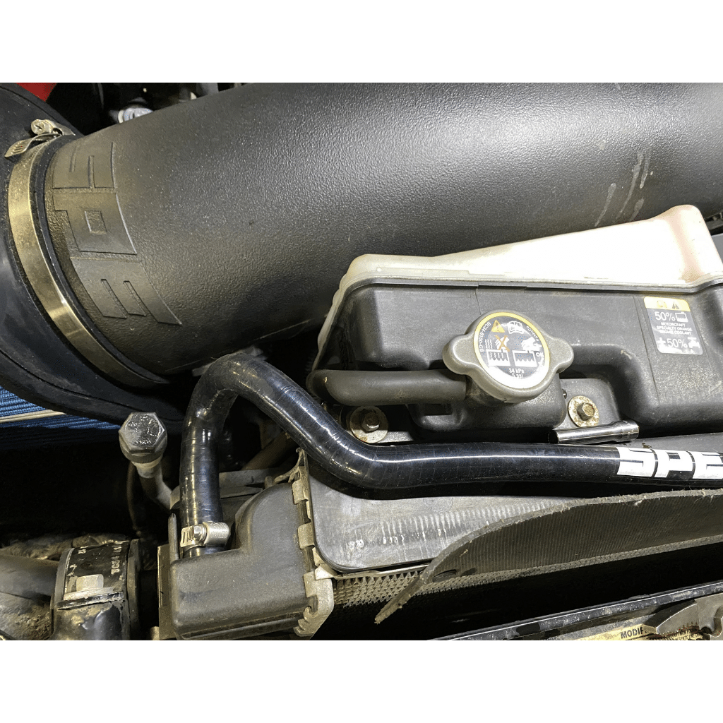 SPE Motorsport 6.7 Powerstroke Coolant Hose Reroute Kit to radiator connection